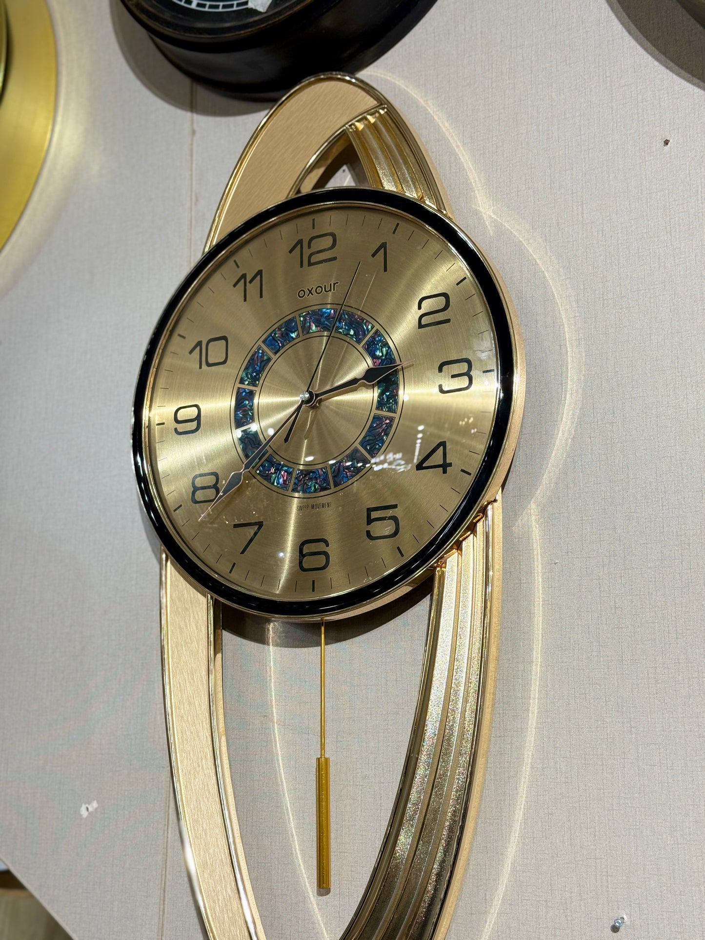Fatima Home Décor Oxour Celestial Pendulum Clock – Luxury Gold Metallic Wall Timepiece