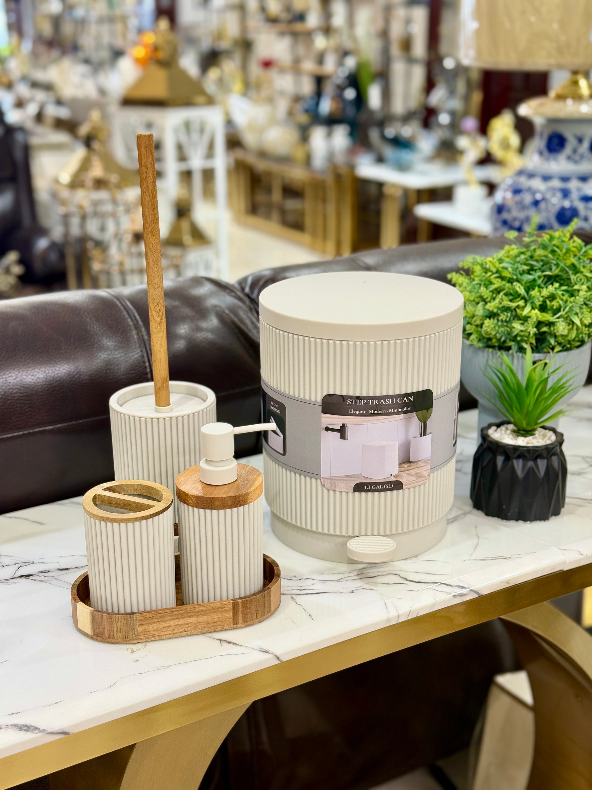 5-piece minimalist off-white ribbed bathroom accessory set including a trash can, soap dispenser, and wood tray at Fatima Home Décor store in Islamabad.