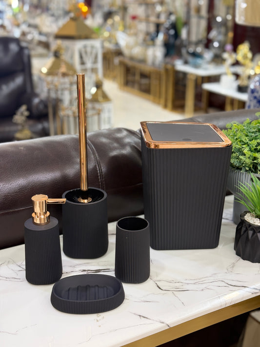 5-piece luxury matte black ribbed bathroom accessory set with rose gold metallic lids and accents at Fatima Home Décor store in Islamabad.
