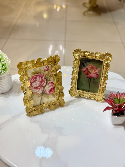Ornate golden resin photo frame with baroque floral carvings and a velvet back, displayed at Fatima Home Décor store in Islamabad.
