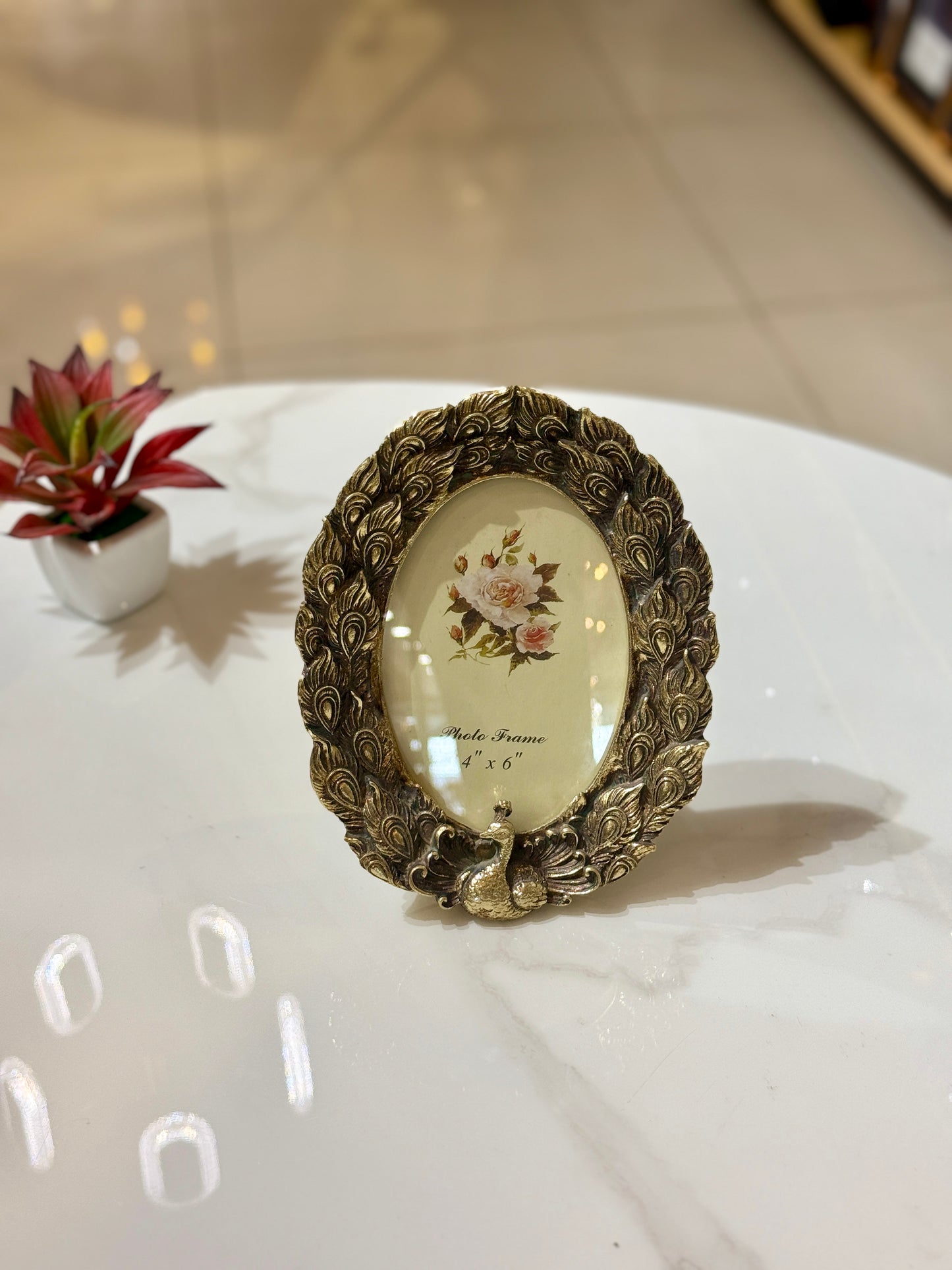 Modern rectangular gold photo frame with a bold geometric ribbed sunburst texture and velvet back, styled at Fatima Home Décor in Islamabad.