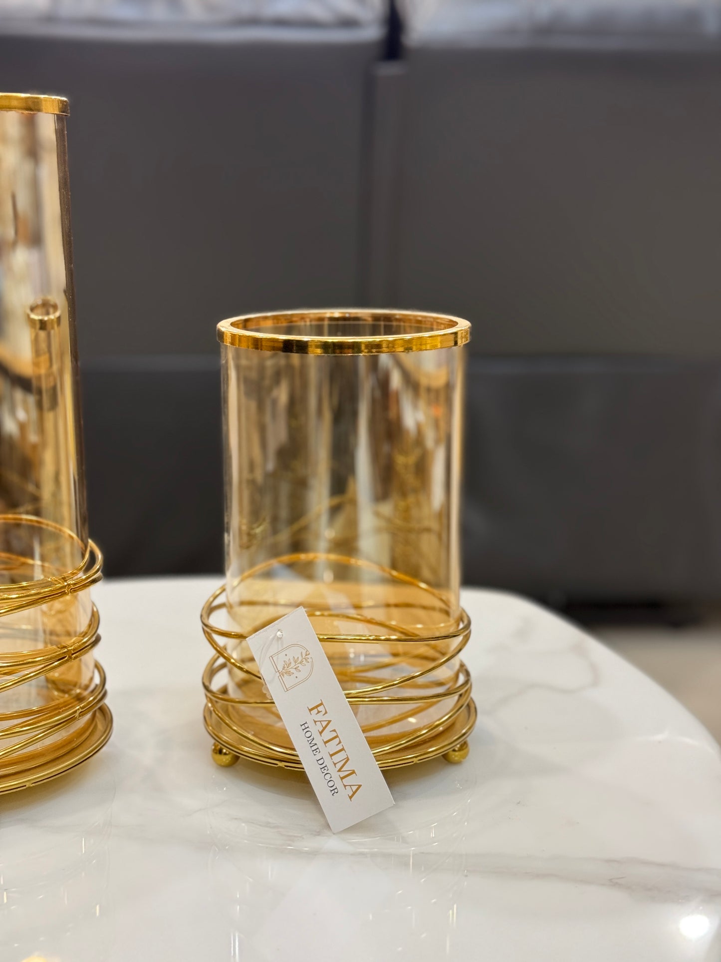 Fatima Home Decor Golden Nest Hurricane Candle Holders - Amber Tinted Glass Cylinders with Metallic Wire Base