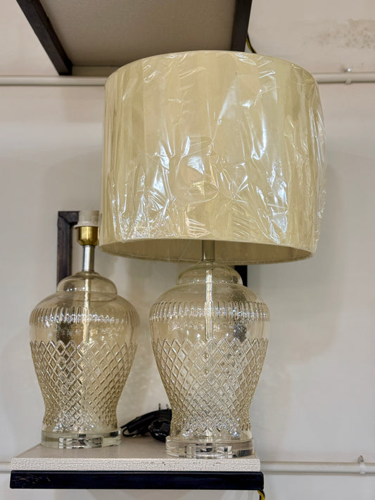 Luxury table lamp with amber diamond-cut glass base and cream fabric shade displayed at Fatima Home Décor store in Islamabad.